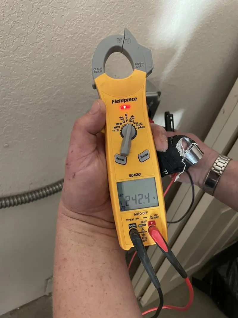 Voltage testing with clamp meter during Outlet Installation in University City